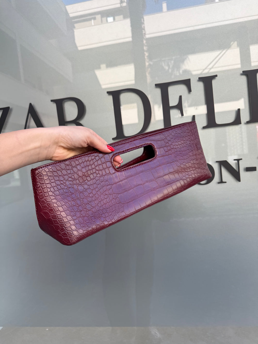 Pochette rettangolare con manico pitonato