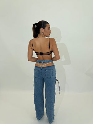 Jeans con apertura strass