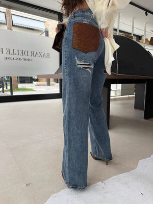 Jeans con tasca strass