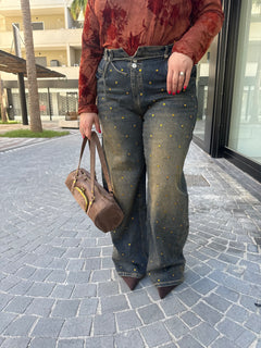 Jeans con punti luce gold