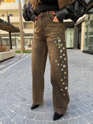 Jeans sfumato con fiori strass
