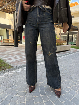 Jeans sabbiato con risvolto