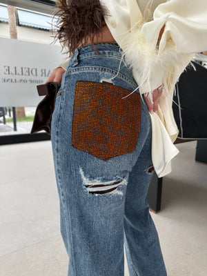 Jeans con tasca strass