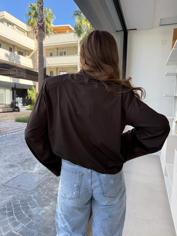 Maglia asimmetrica con piume