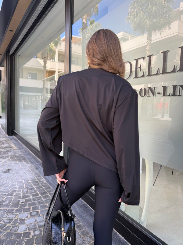 Maglia asimmetrica con piume