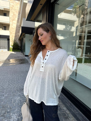 Maglia trasparente bottoni